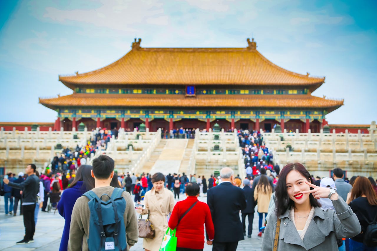 who-we-are Tourists exploring the iconic Forbidden City in Beijing, a UNESCO World Heritage Site.