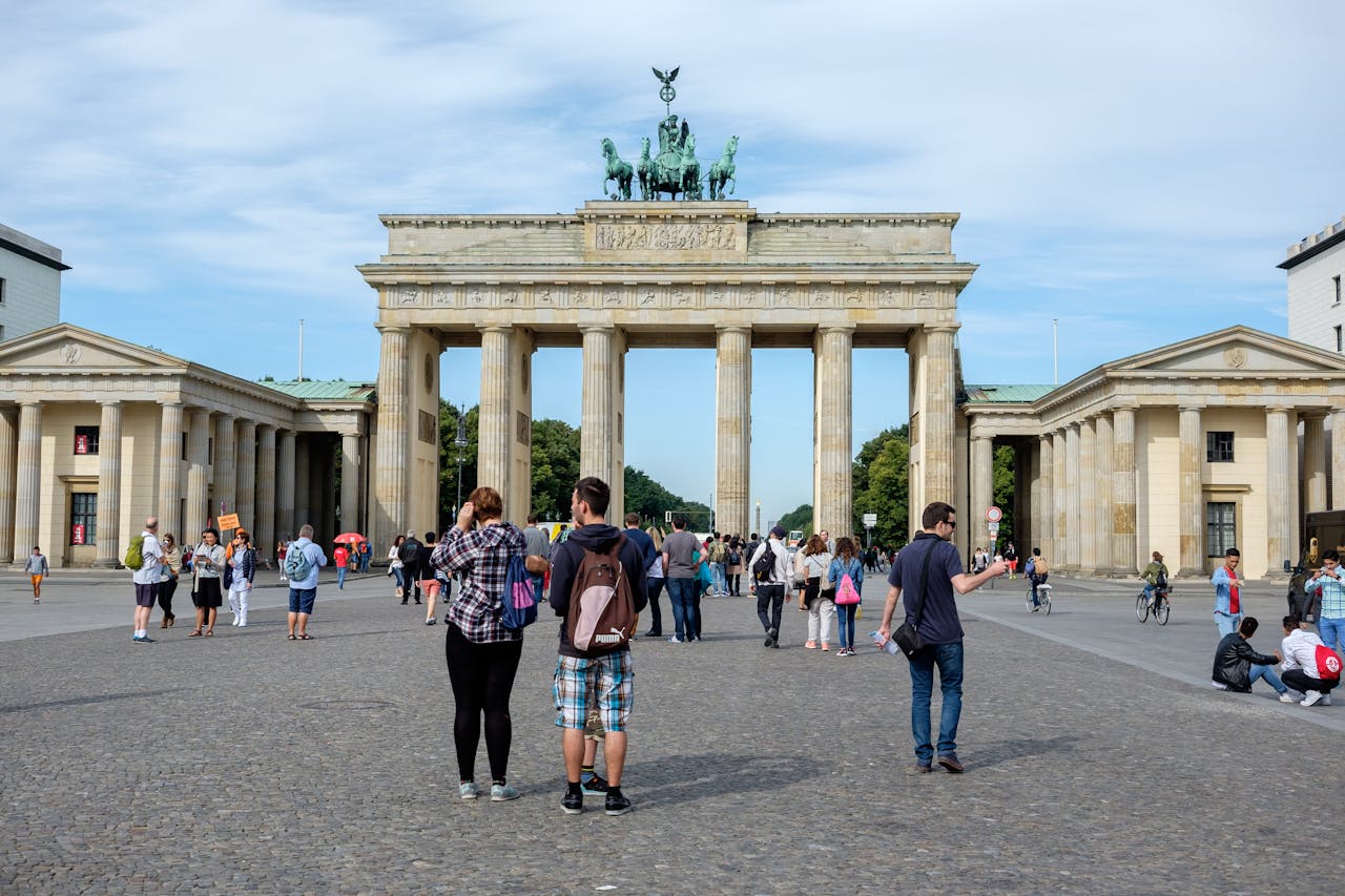 services-01 Visitors explore the iconic Brandenburg Gate in Berlin, Germany.